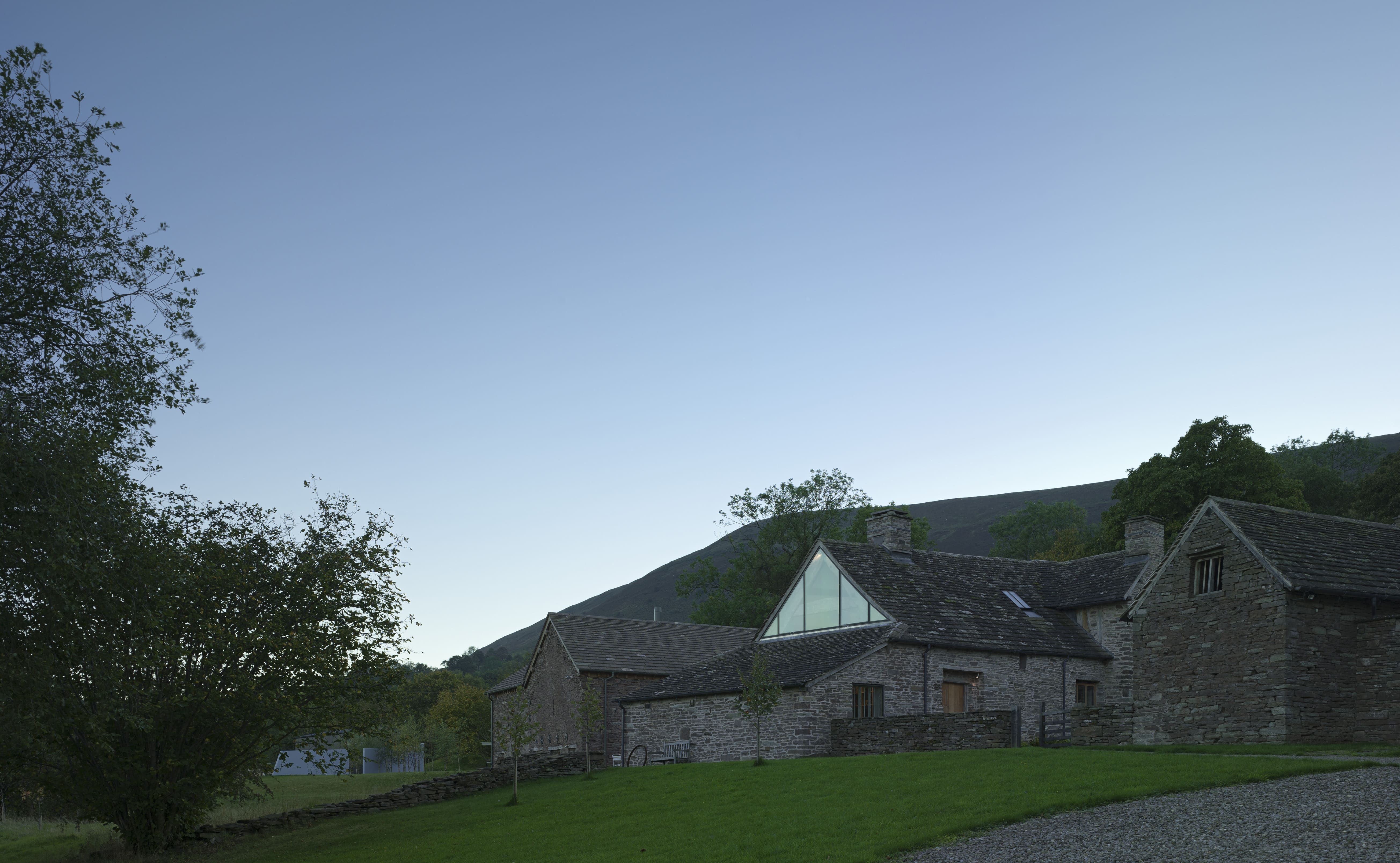 conversion of a 14th century farm house. A low stone building set in the hills. 