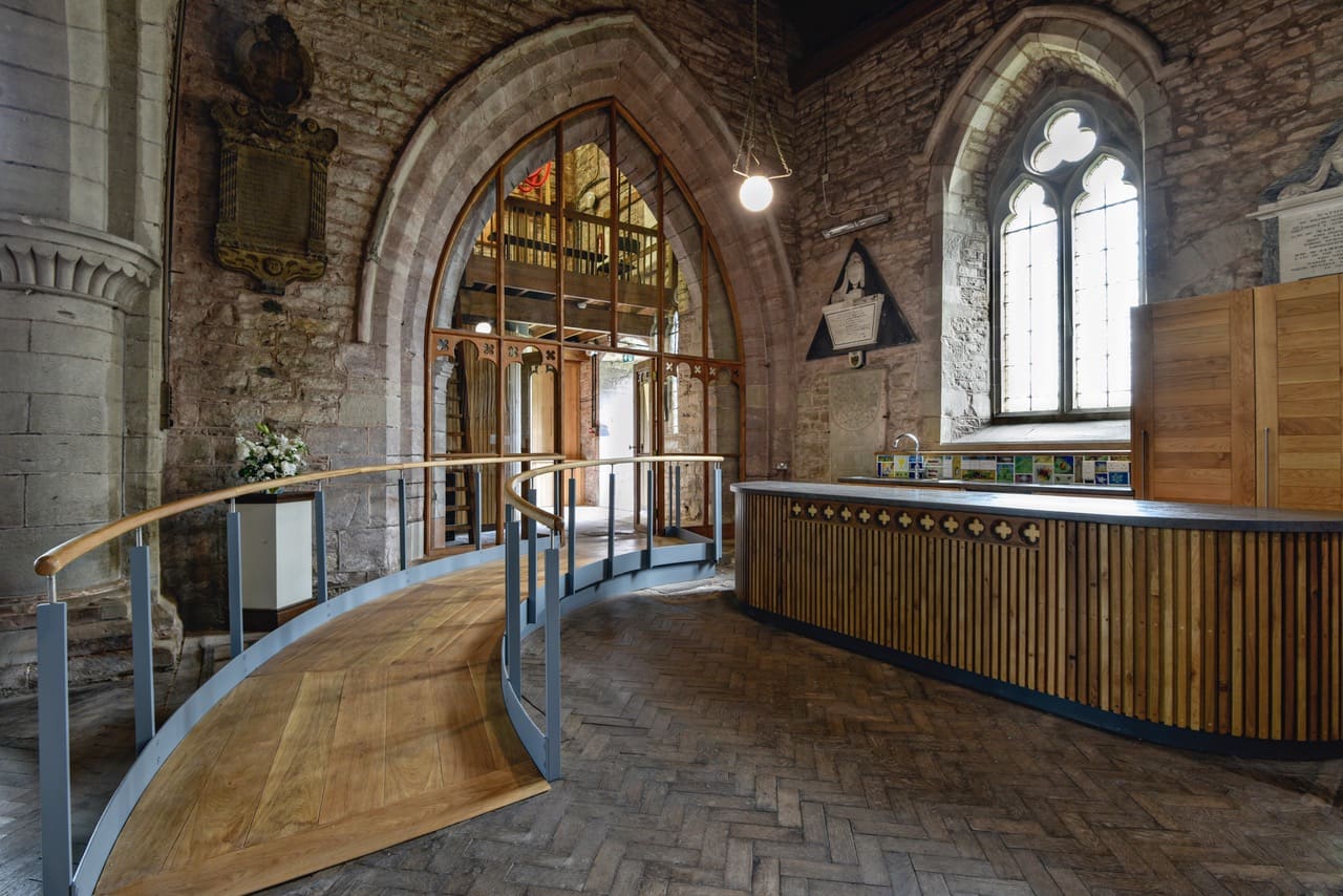 Interior of St Michaels and All Angles, a church re-ordering, image shows a ramp to the left and a kitchenette area to the right.