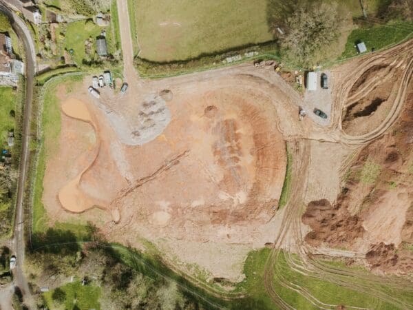 A birds eye view taken by a drone and looking at a new countryside building site. Communion Architects Hereford